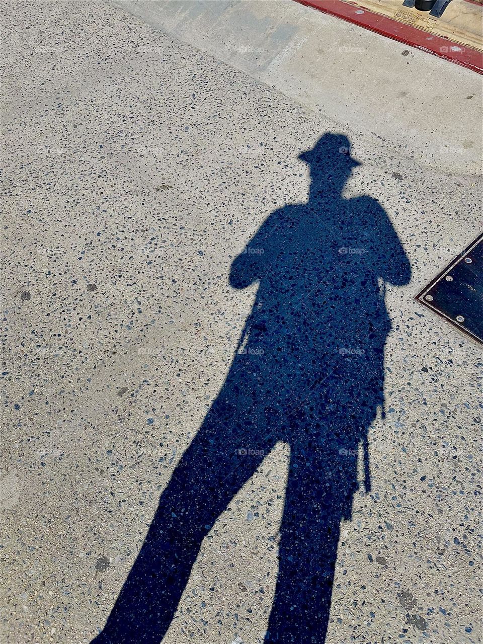 The shadows cast on the asphalt of the pedestrian lane of the “Pulaski Bridge” at “Newtown Creek” that connects “Greenpoint”, Brooklyn to LIC, Queens can be quite dramatic and immensely theatrical. 2024. Hypnotic Productions