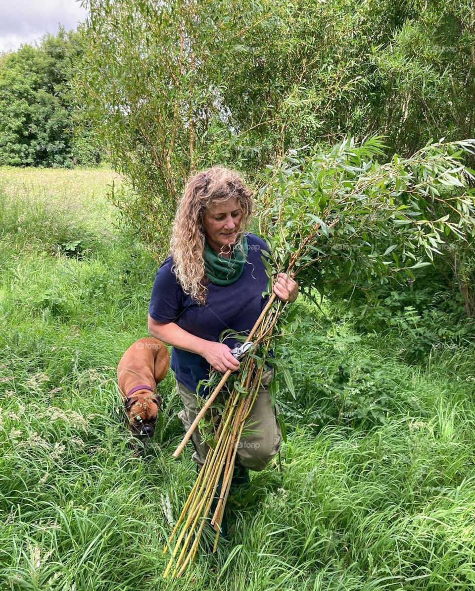 woman with dog in the jungle