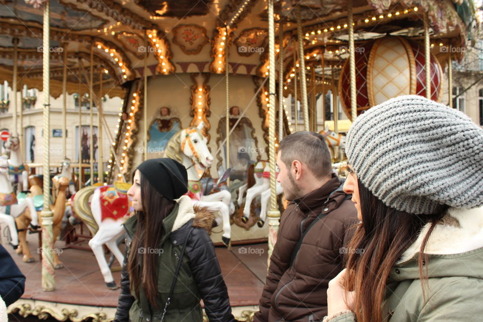 People in front of an a Carousel 