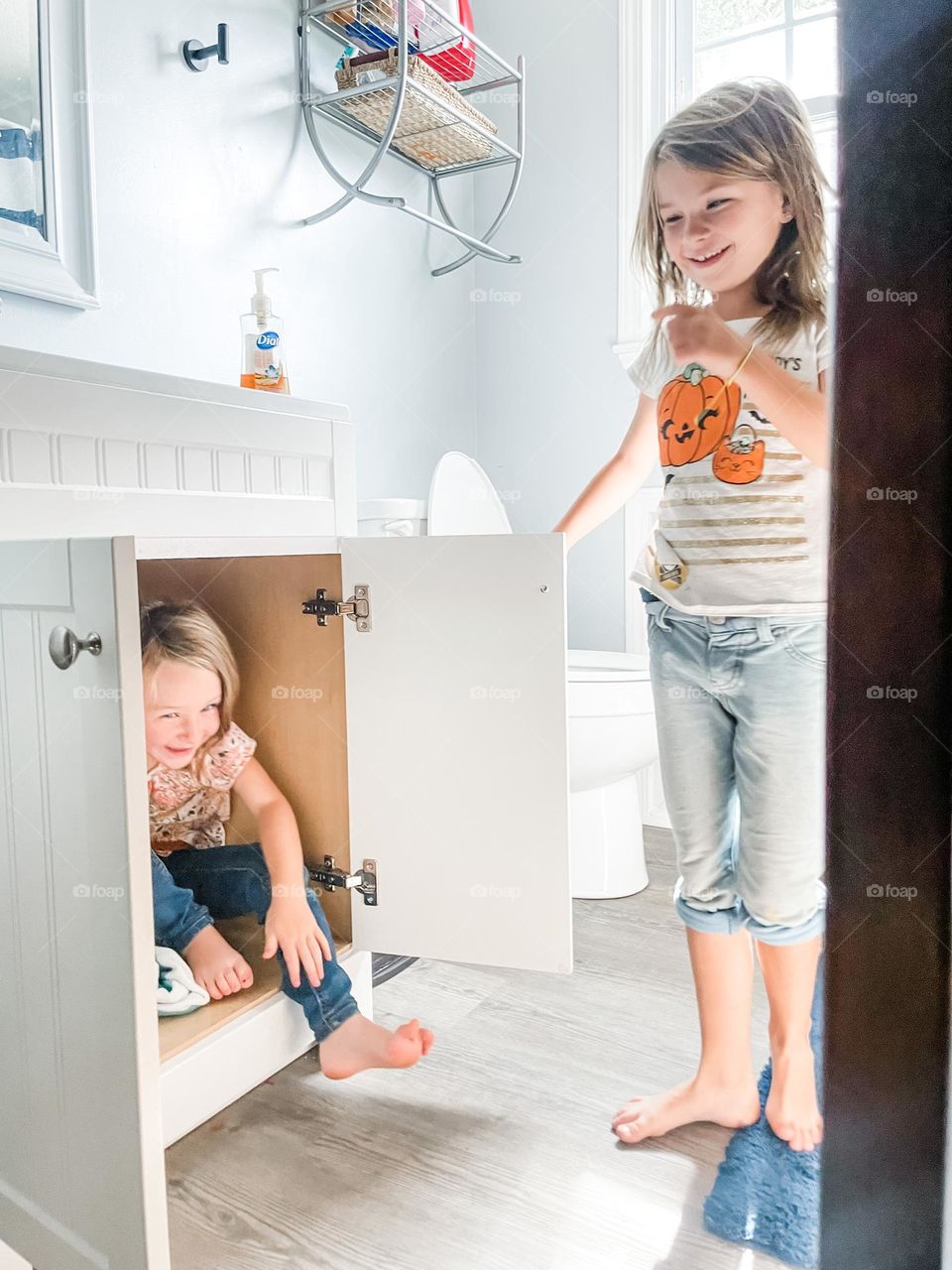 Sisters playing hide and seek