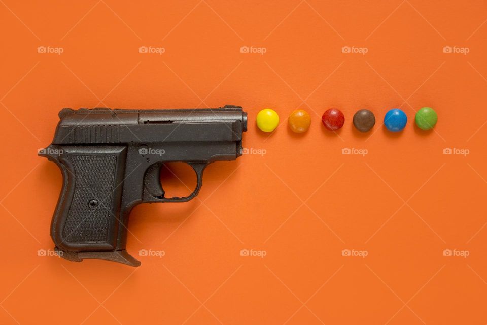 Chocolate gun and candies