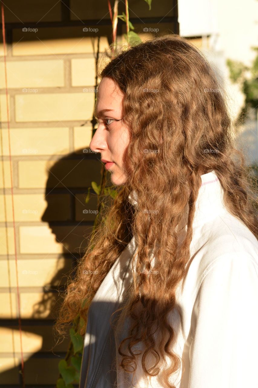 young girl beautiful portrait in sunlight and shadows