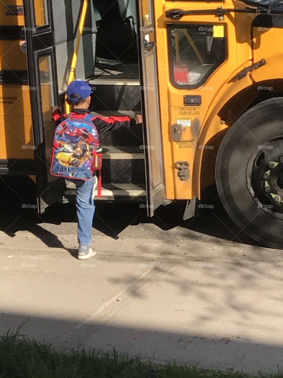 Child going on school bus