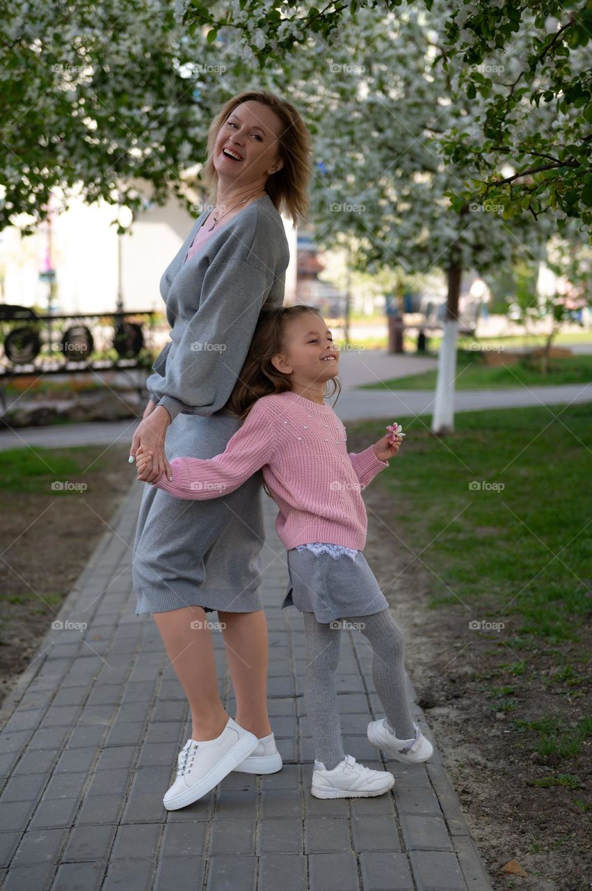 Family walking on urban park 