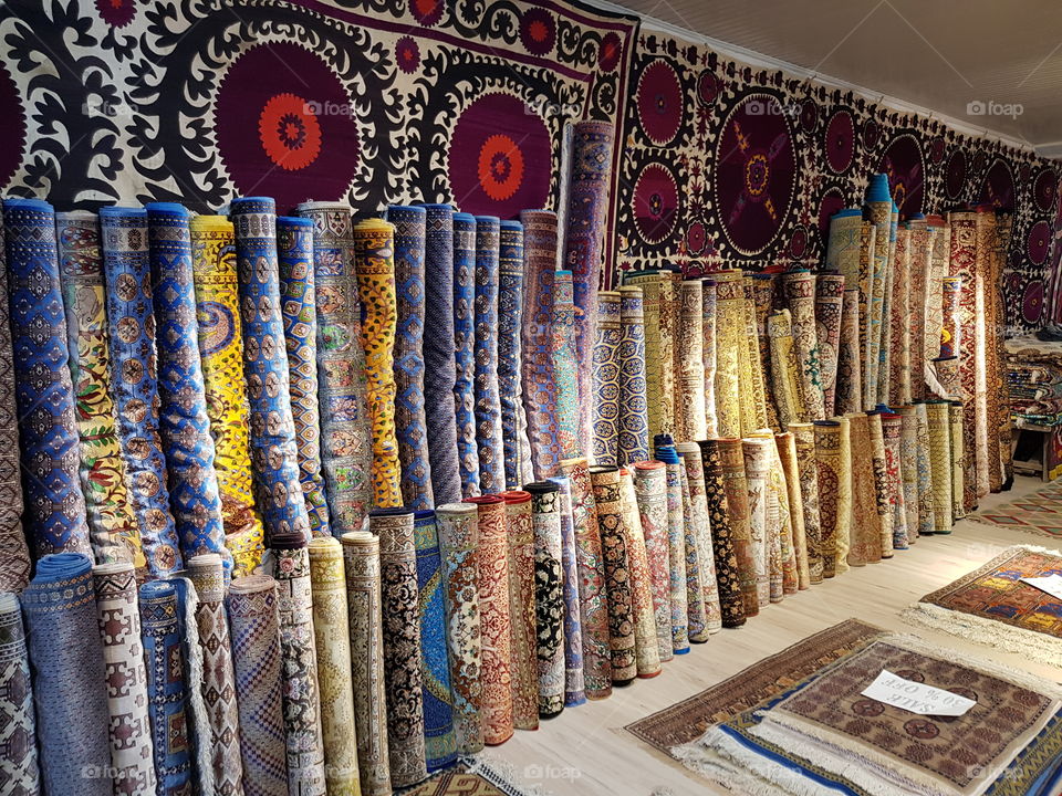 Colorful silk carpets in the showroom of a carpet factory in Uzbekistan