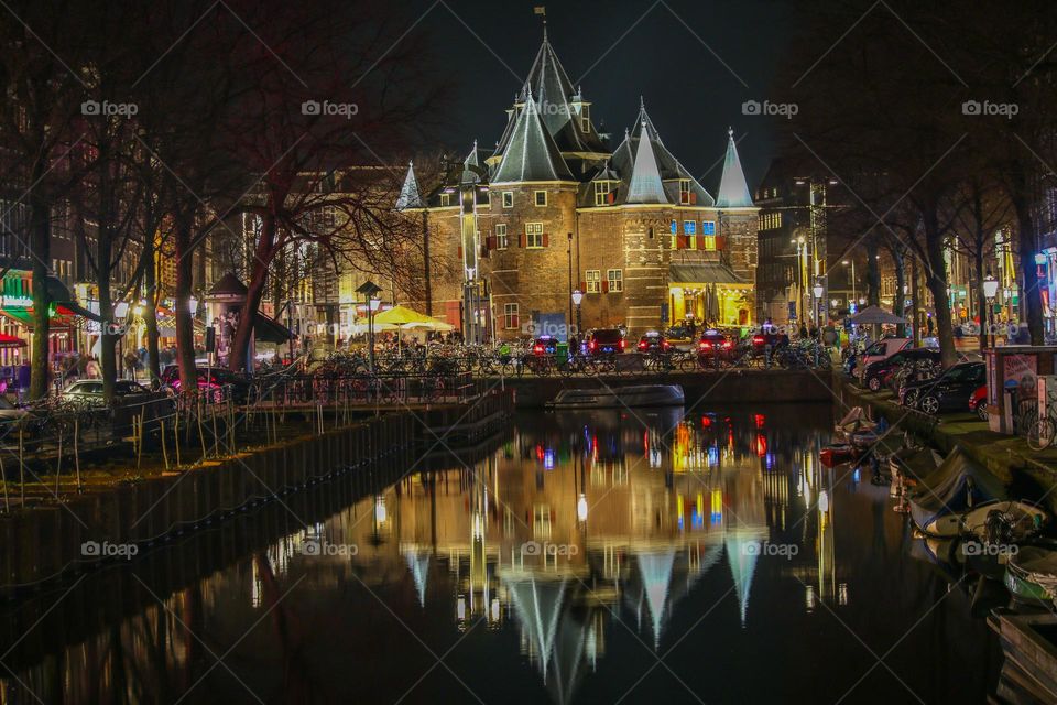 Castle mirroring on a canal in Amsterdam