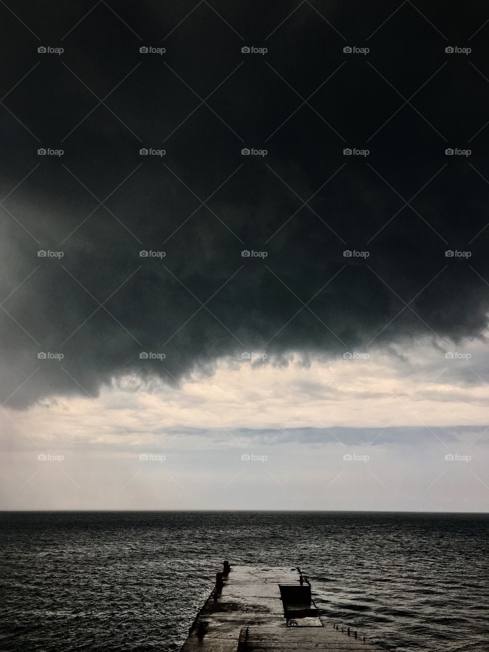 Dark cloud above the sea 