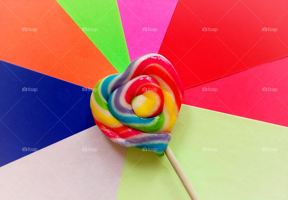 Rainbow candy on the top of origami paper...