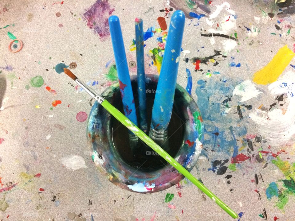 Paint brushes in container