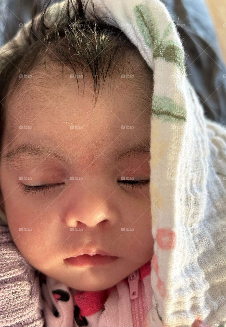 Newborn baby closeup of face