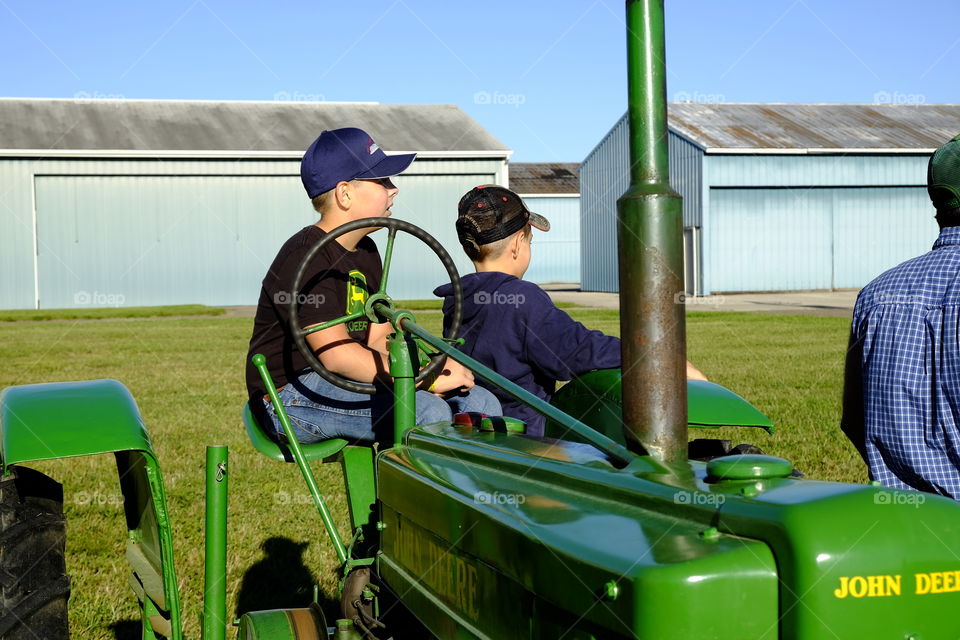 Boys on a tractor 