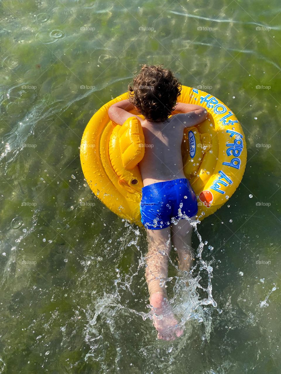 Mosses, sea and a boy