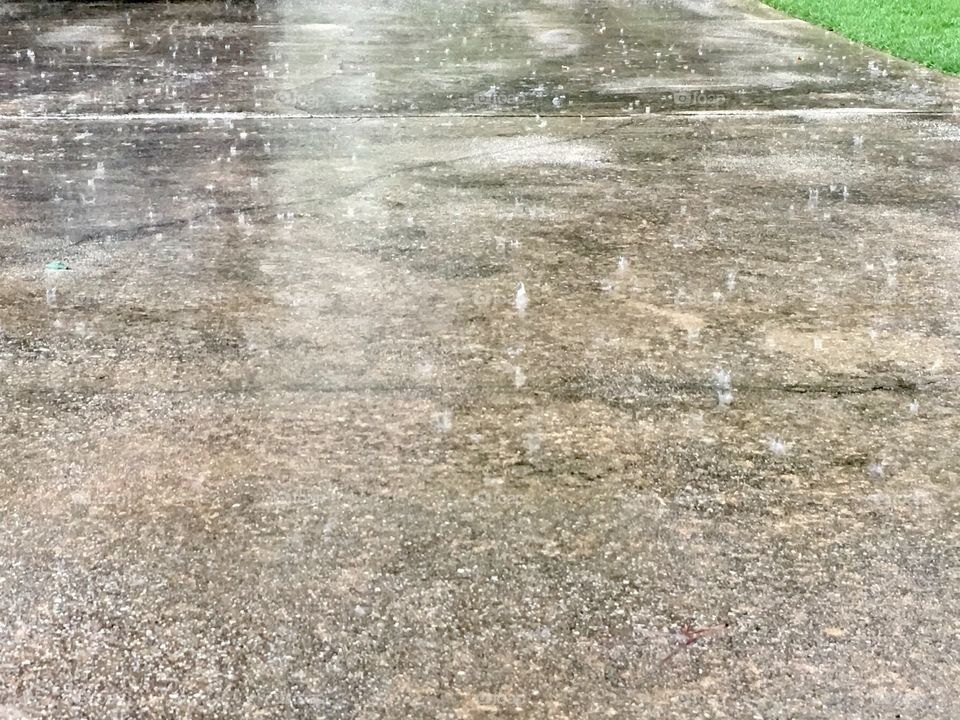 Raindrops on the pavement.