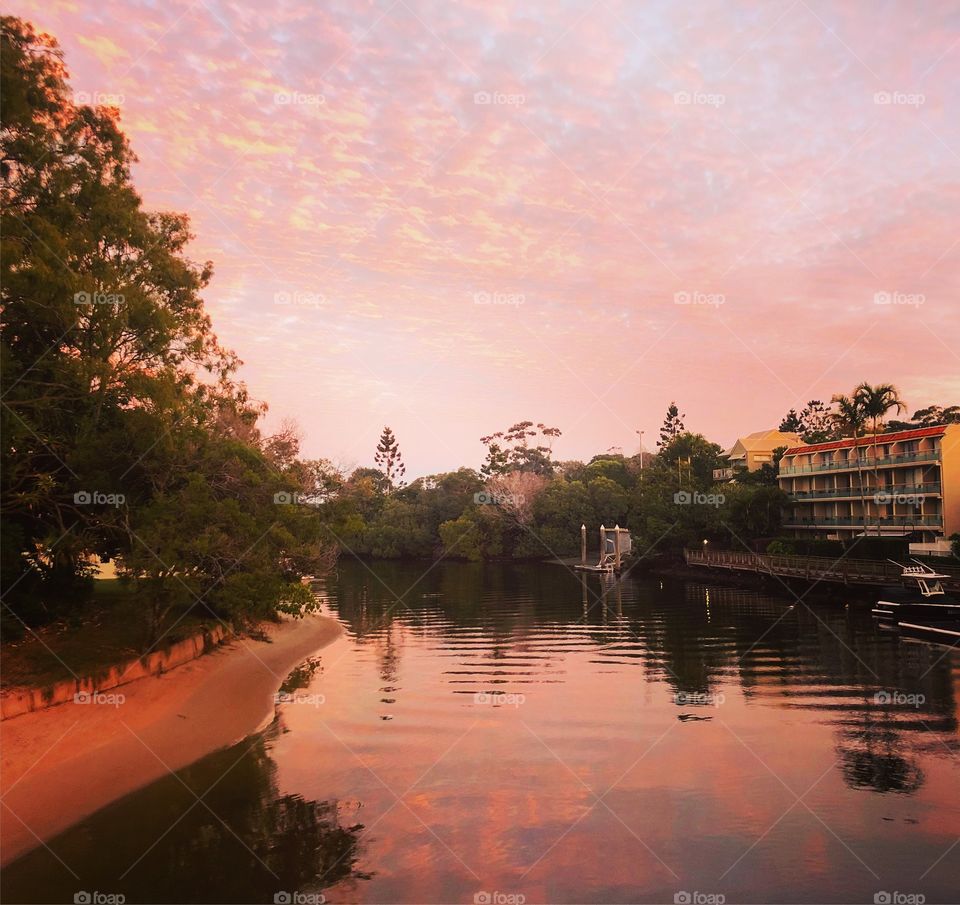 Pink skies and pink water in the morning on the river 
