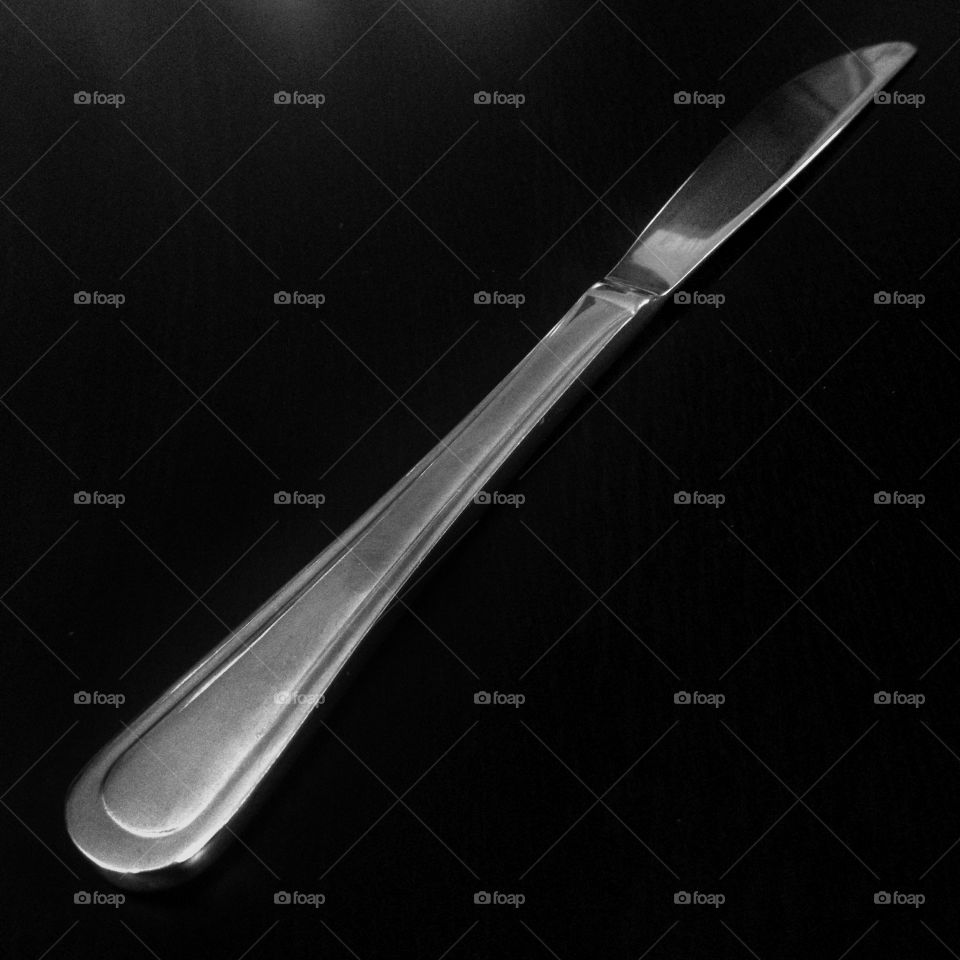 A knife in a black and white square shot