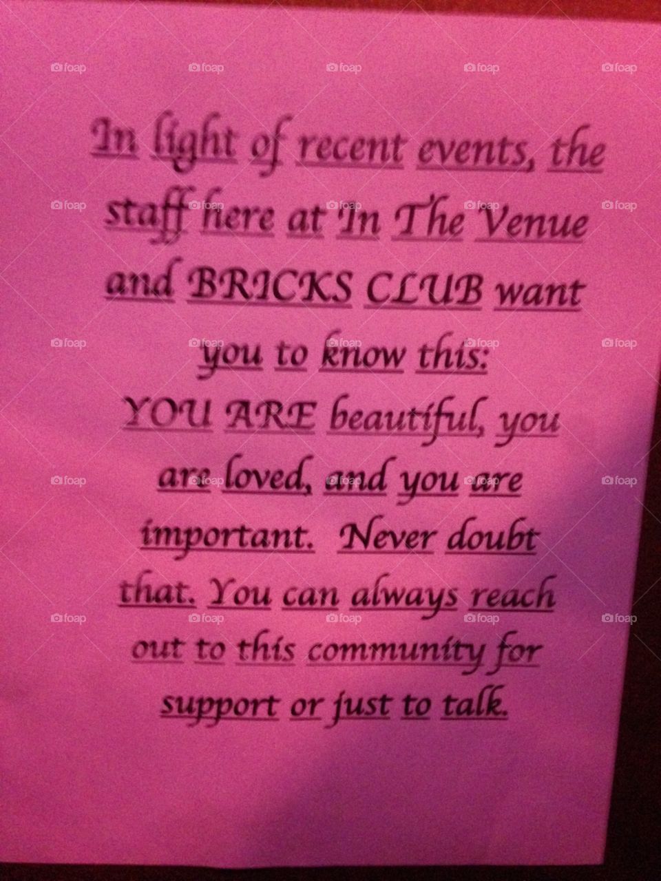 sign in woman's restroom at concert venue