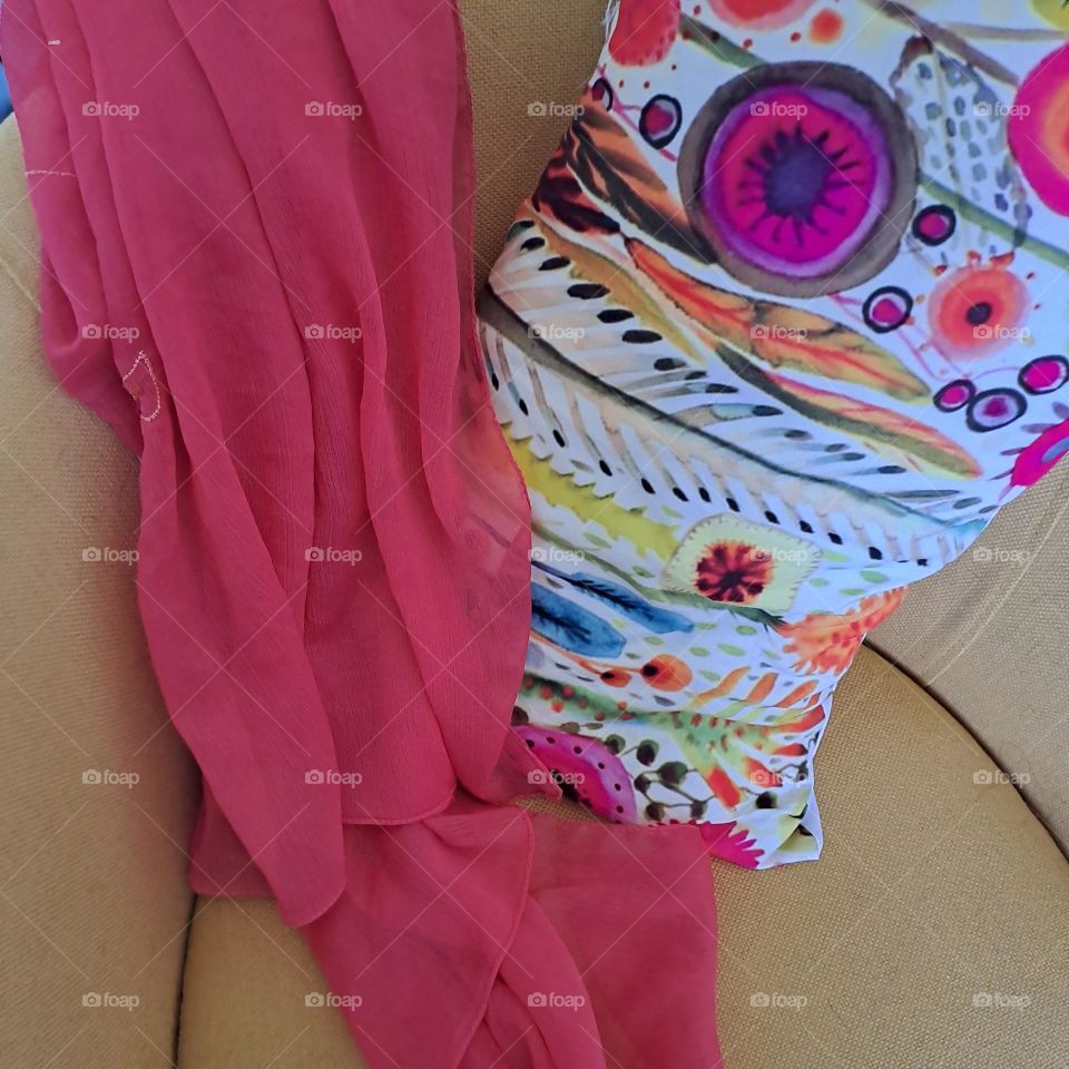 Brightly coloured scarf cushion and chair. Autumnal. yellow, orange.Seat