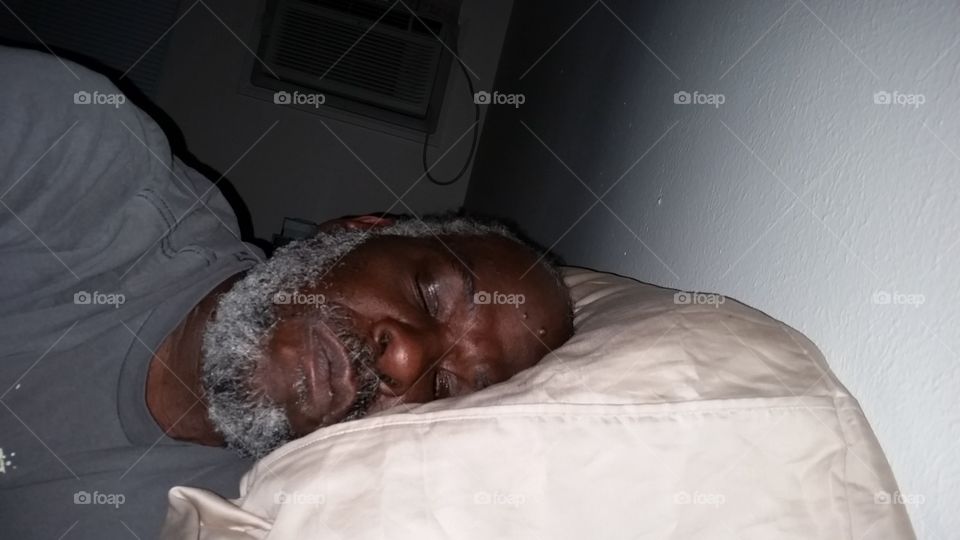 older African-American man sleeping