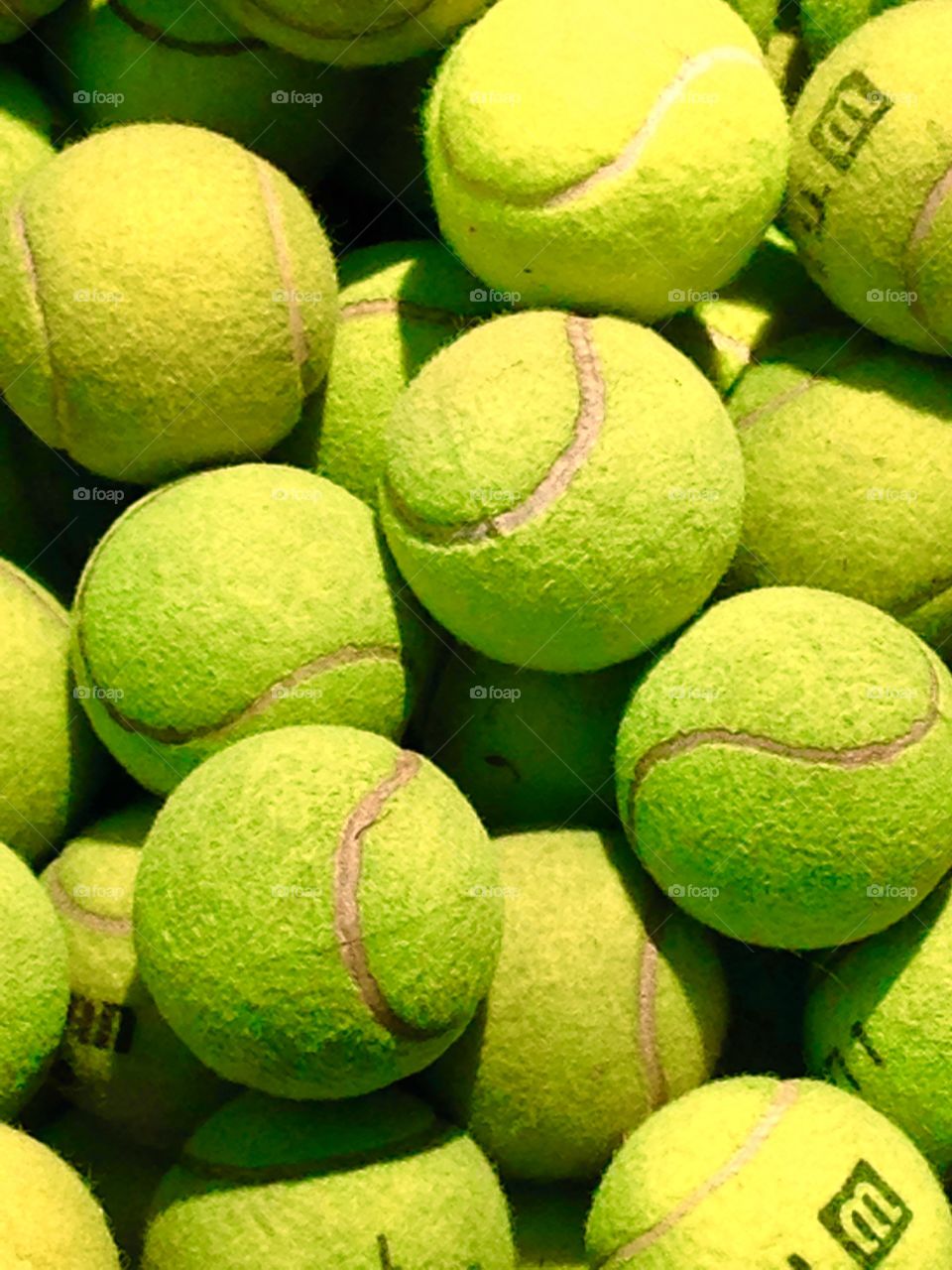 Tennis Anyone?. Old yellow tennis balls