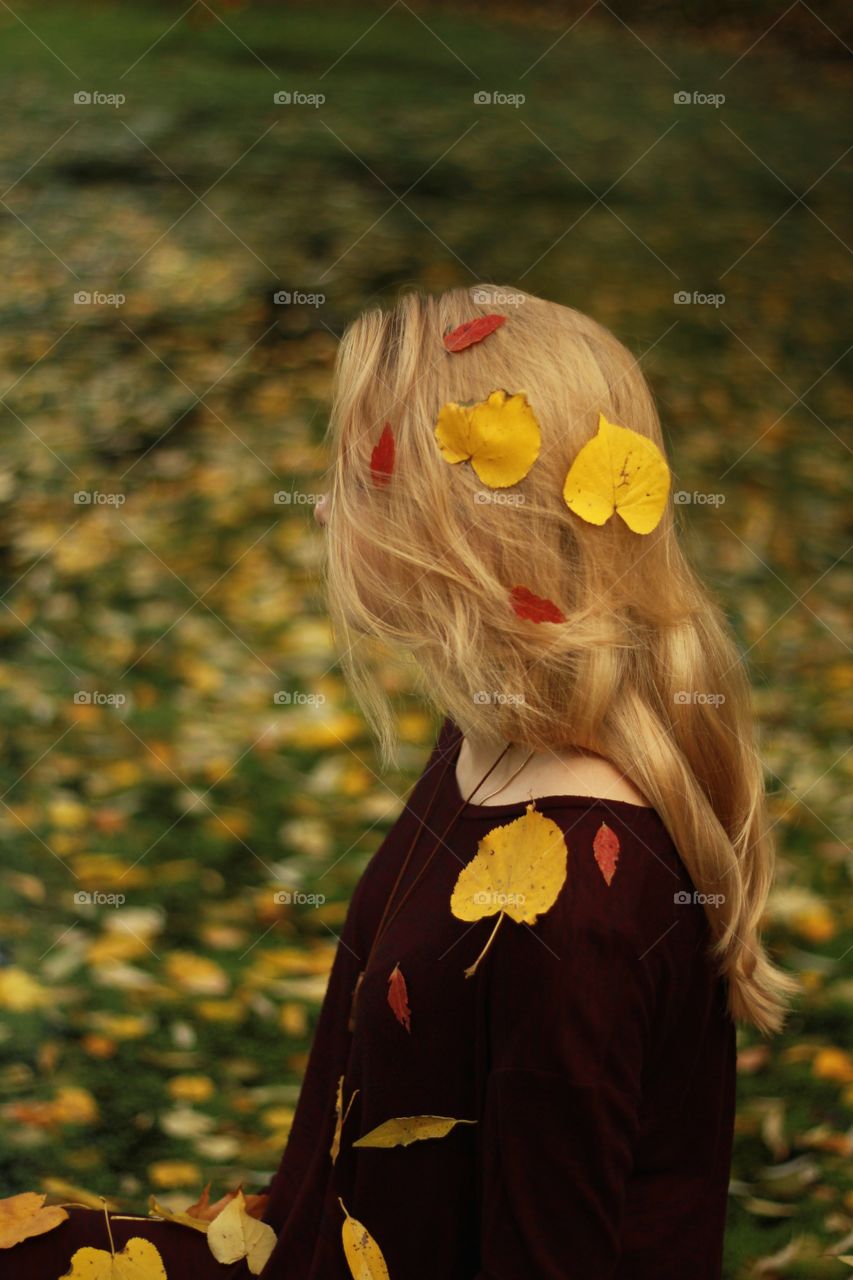 The falling leaves on a girl