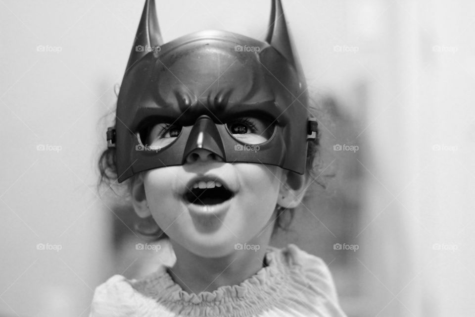Child wearing Batman mask
