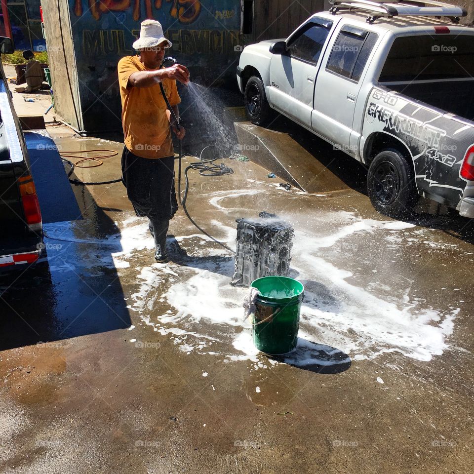 Washing engine block.