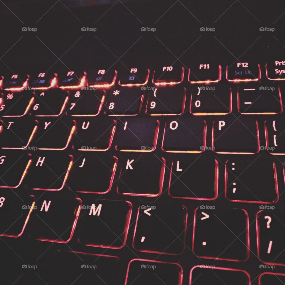 photo of bright red backlit keys on a keyboard