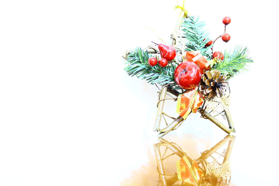 Christmas wooden star with decorations on a wooden table