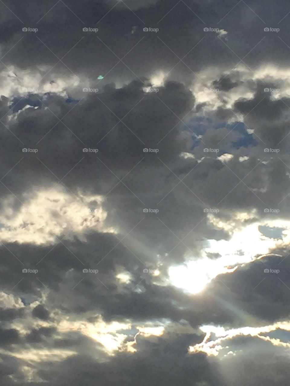 sun peeking through the clouds 