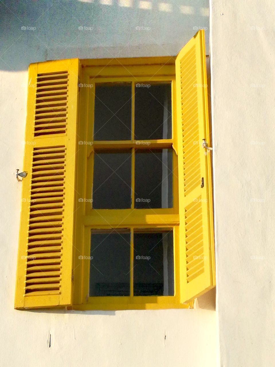 yellow shutters Window