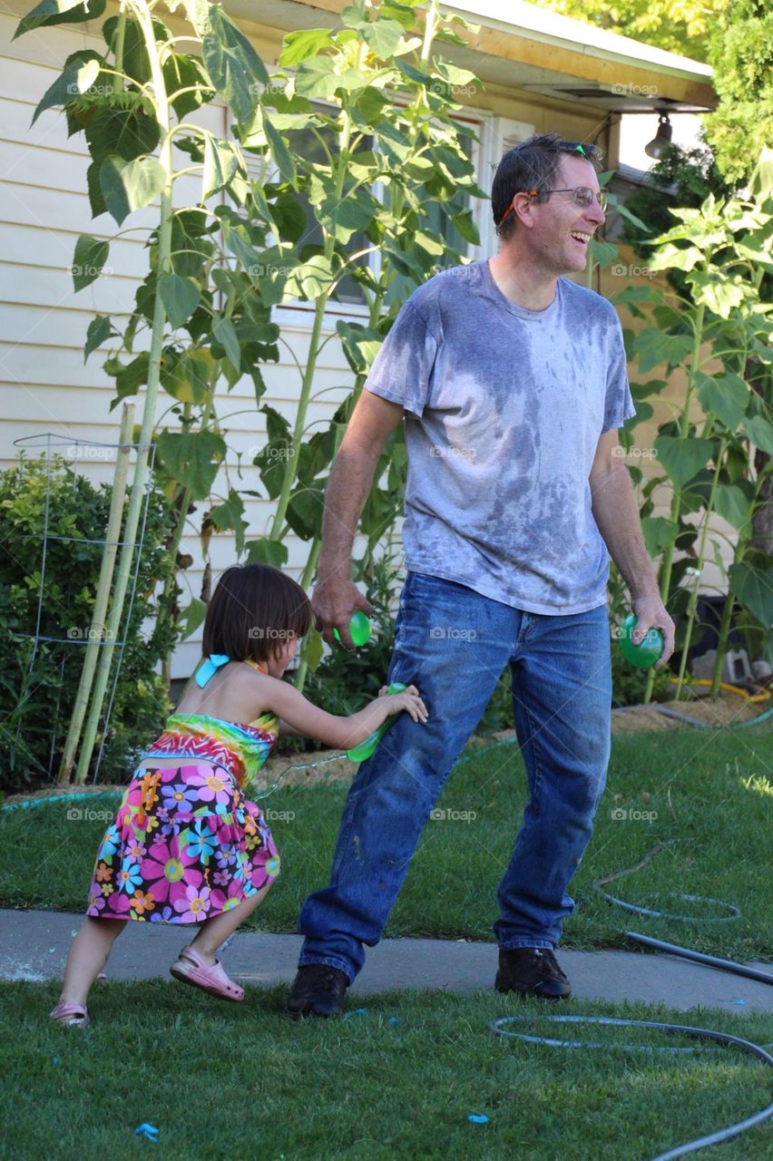 Popping water balloons