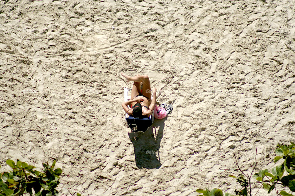 Girl sunbathing on the beach