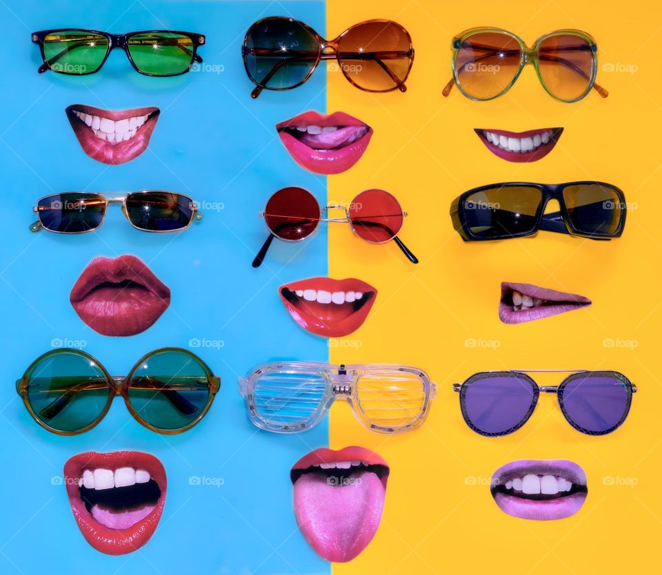 Sunglasses & smiles (not a composite graphic) assorted sunglasses placed with cut out smiles on blue & yellow background 