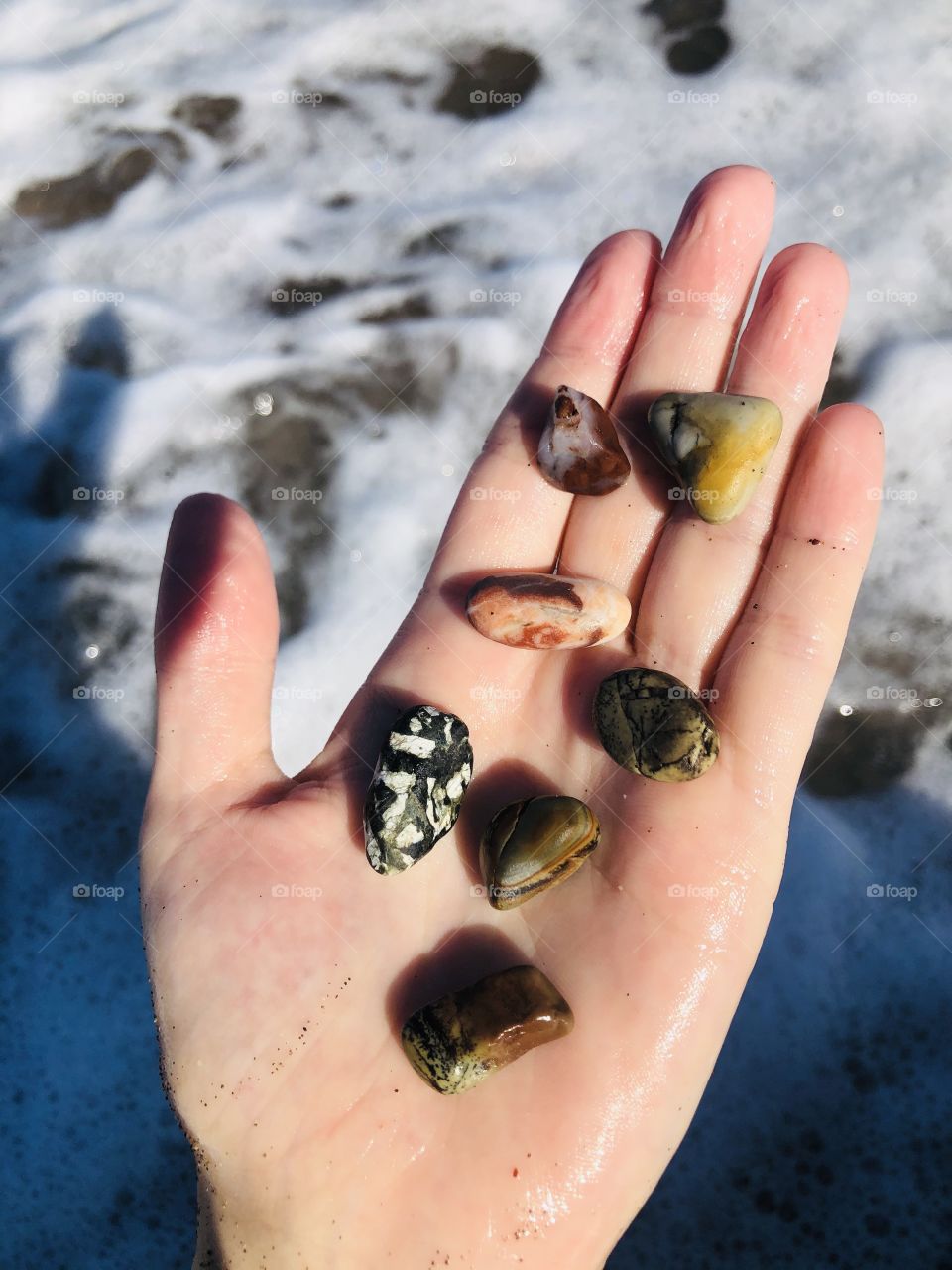 Picking up stones from the beach 