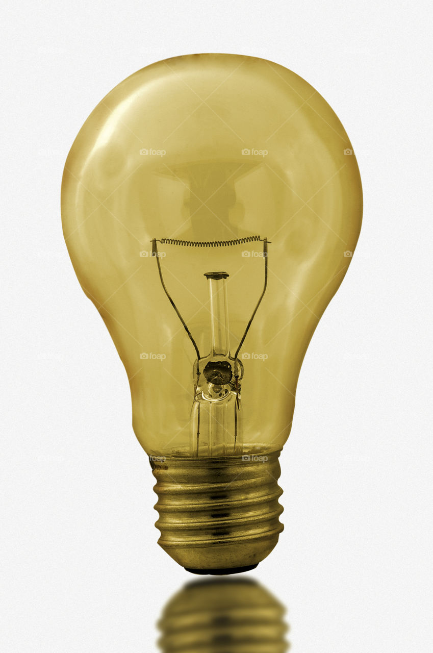 Golden bulb on white background