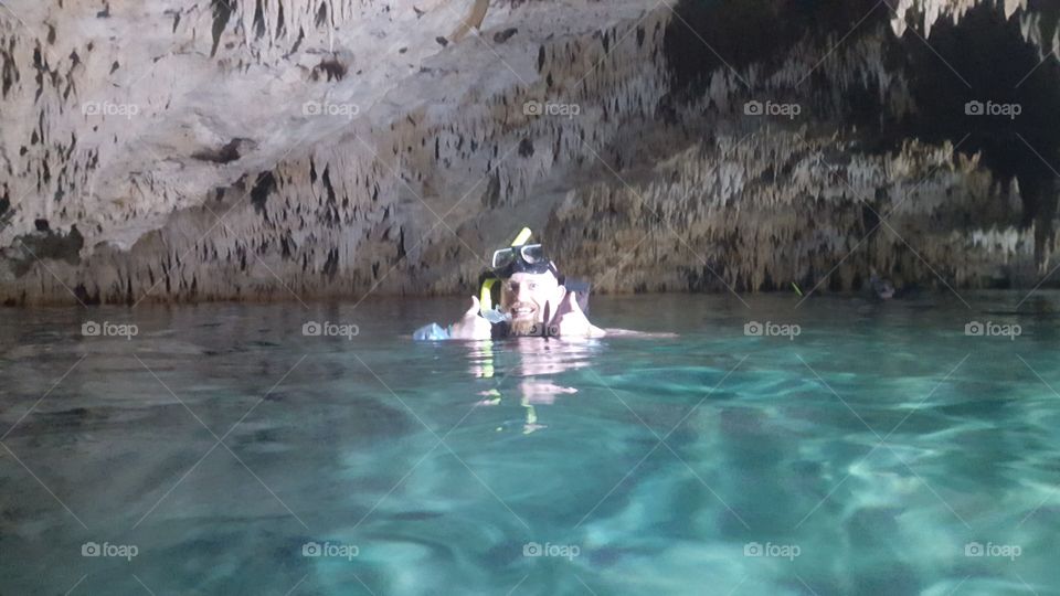Happy snorkeling in a cave