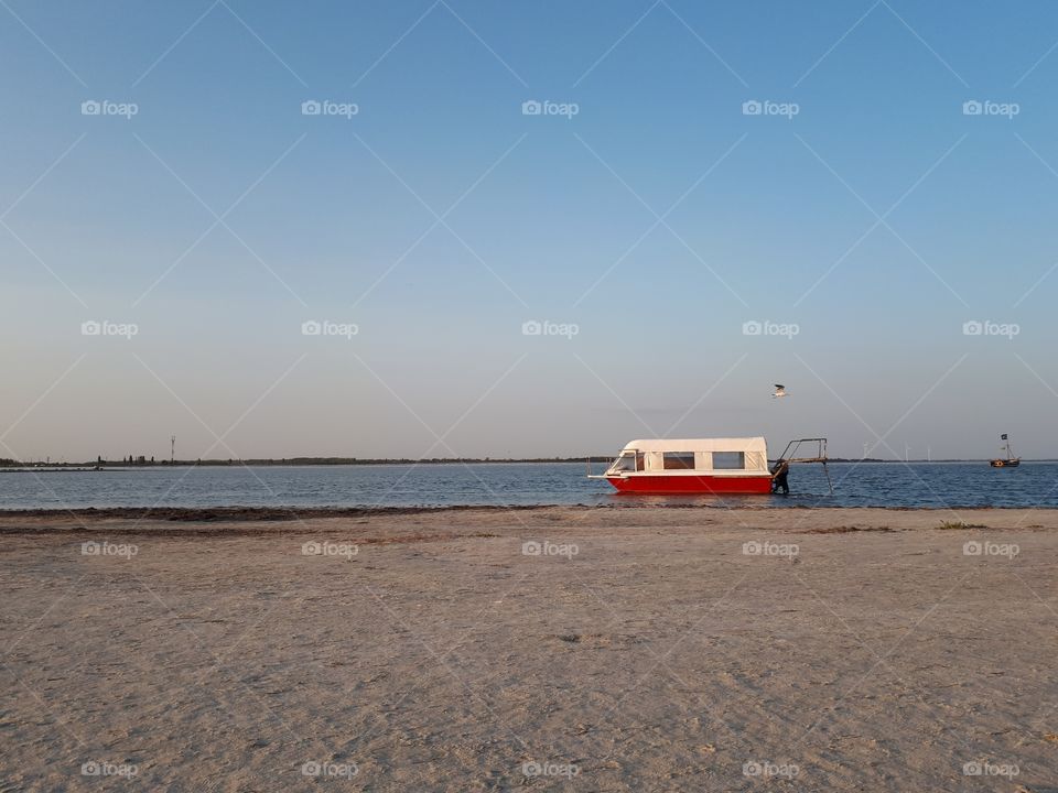 Boat alone at the sand beach