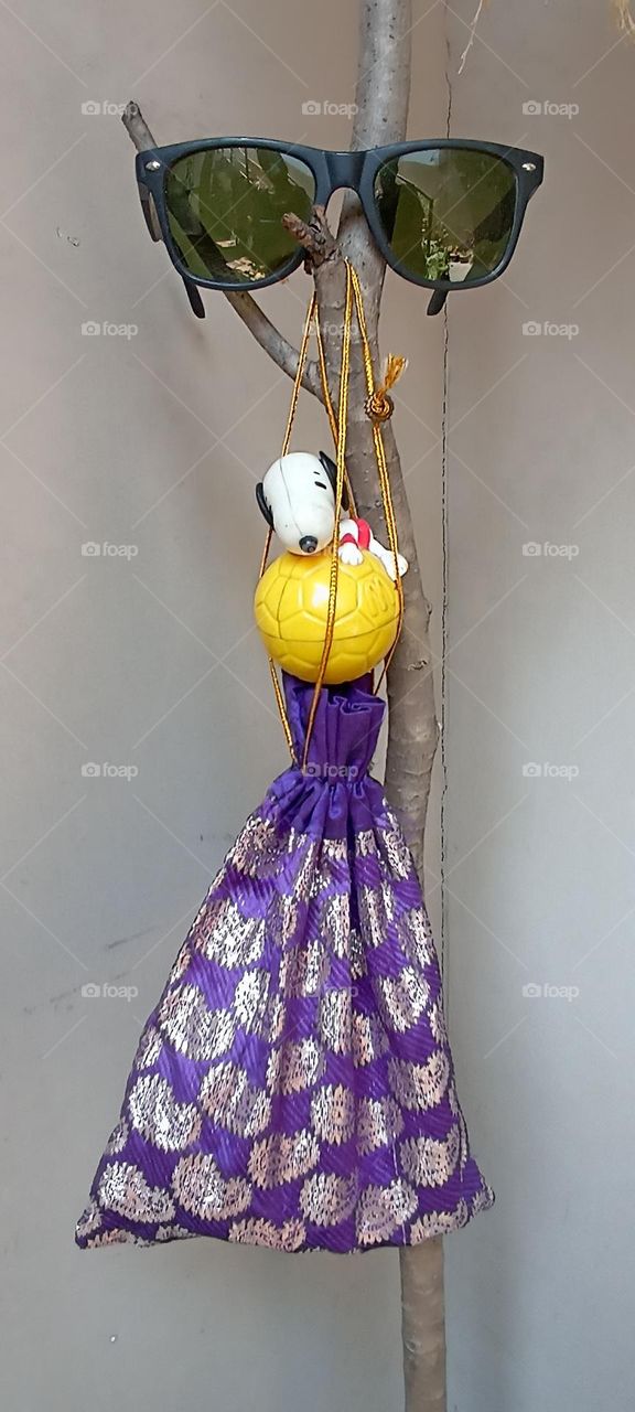 fun with different objects of different colors tried to create a funny look in my garden corner in a day light.in my eyes it's an art piece