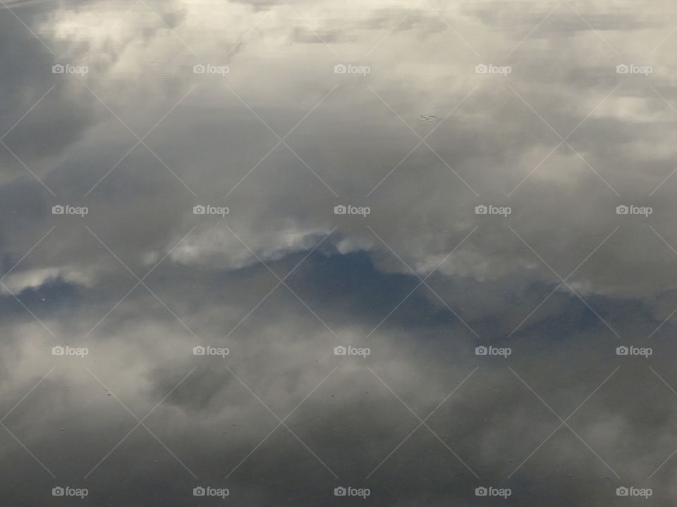 Clouds reflecting in water