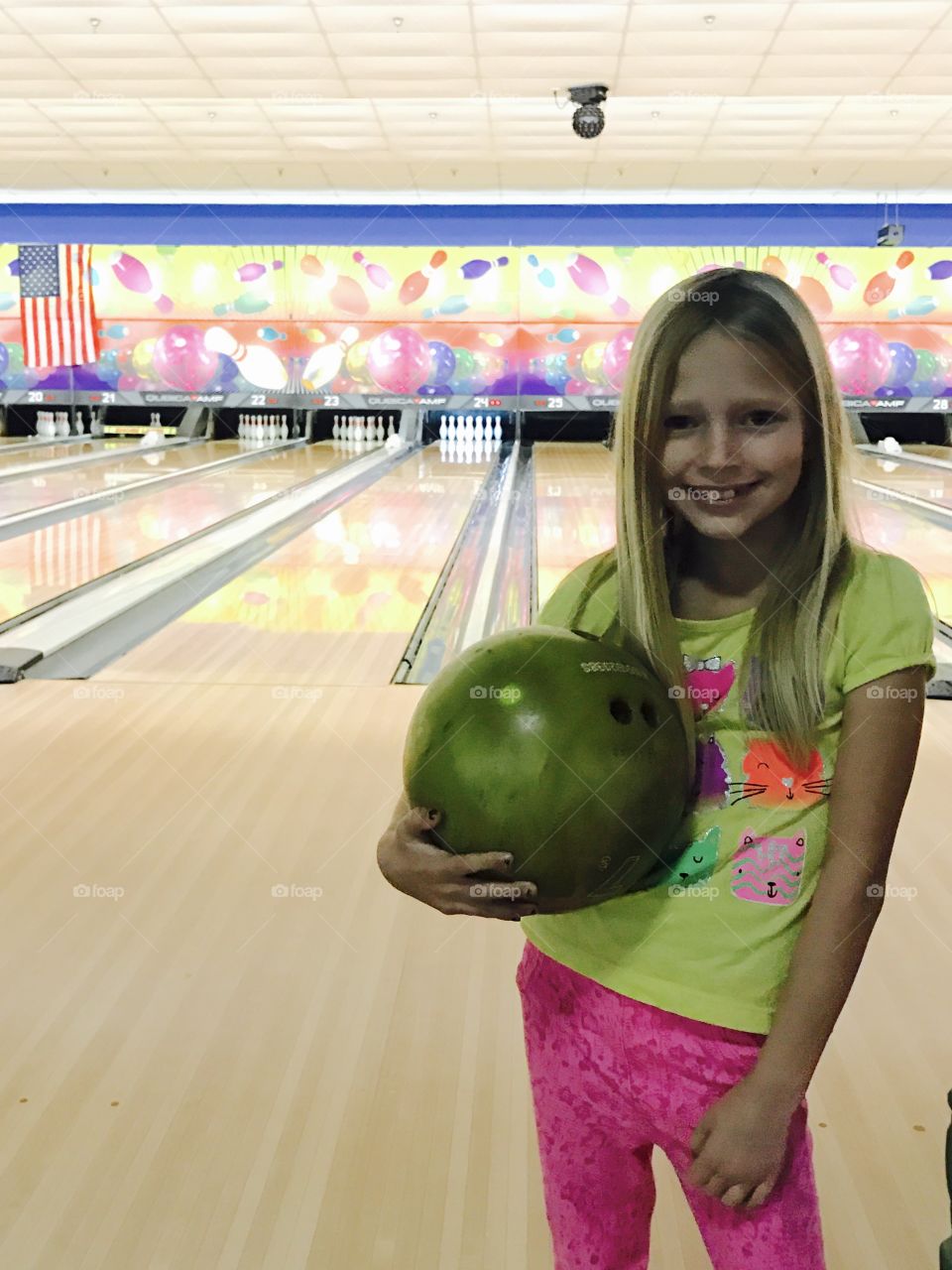 Little girl bowling 