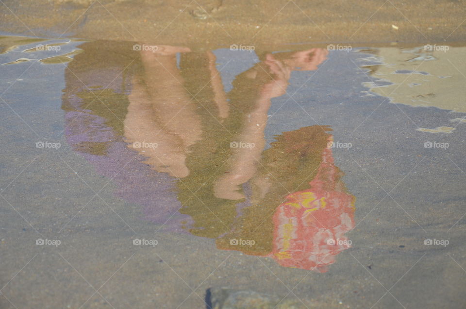 Reflections of the beach rock pools