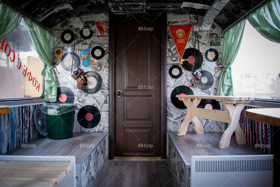 Old vinyls, newspapers and camera on the wall