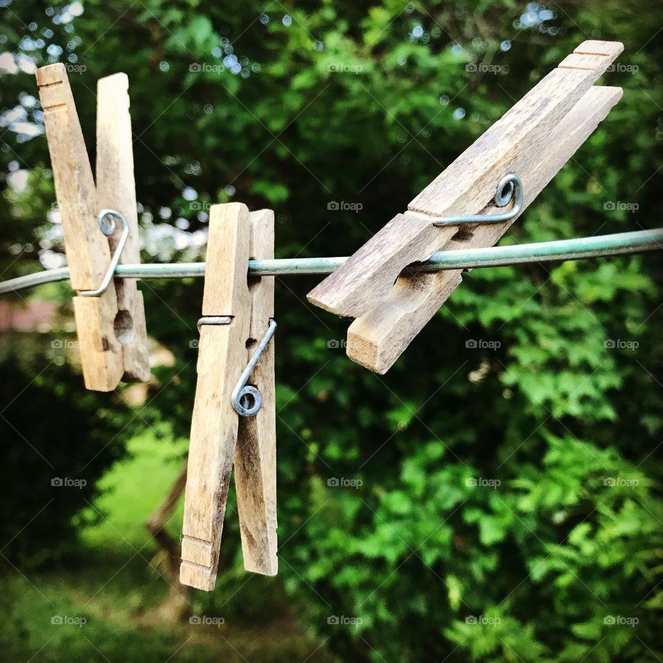 Wooden clothes peg on clothes line