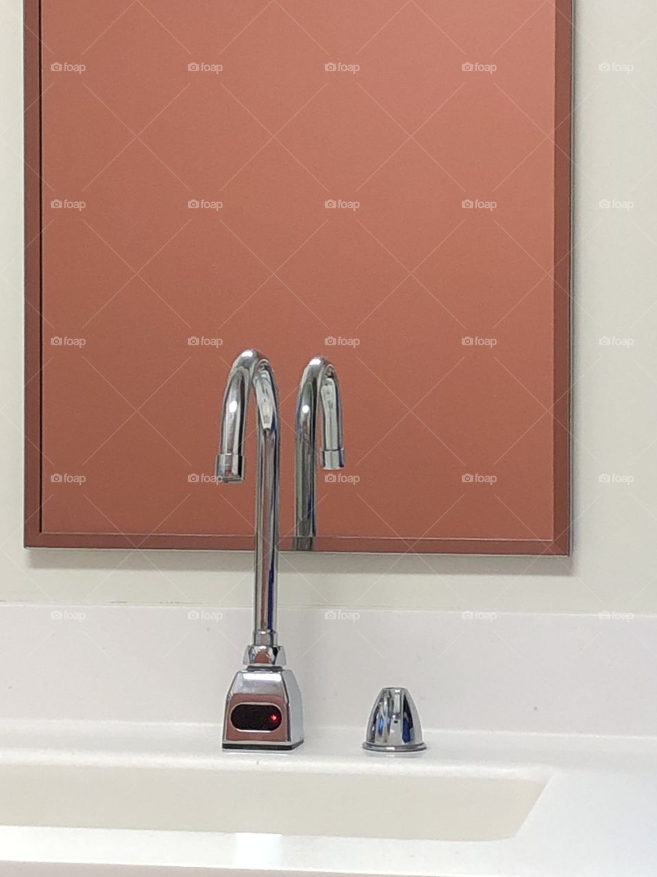 Reflection of a sink faucet 