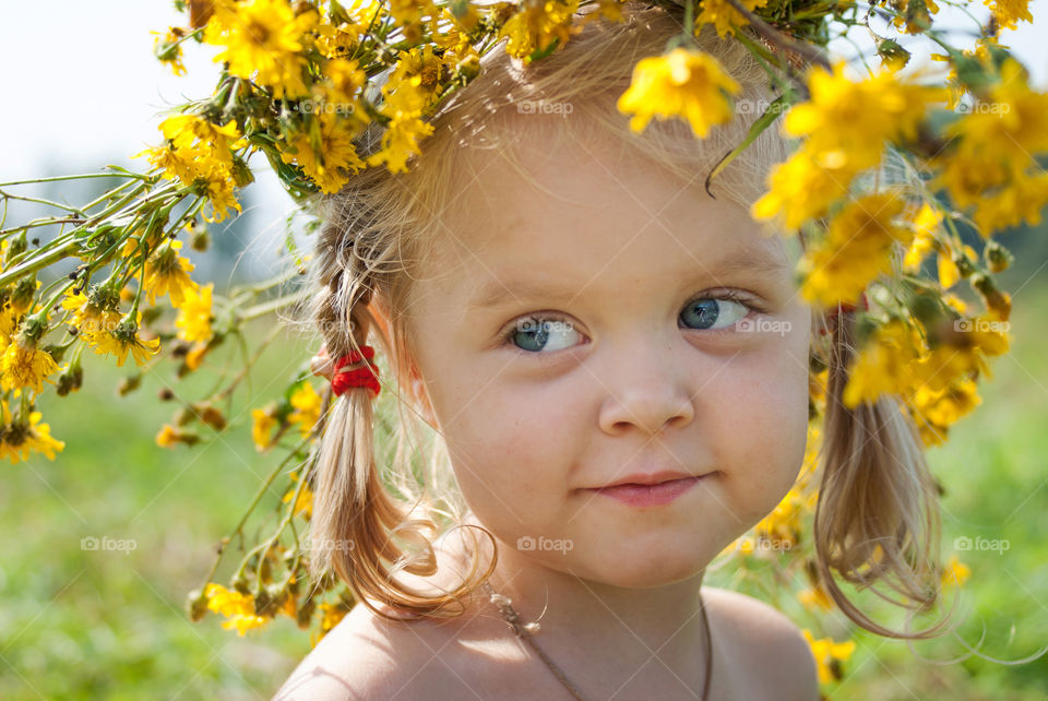 Cute girl wearing flower wreath