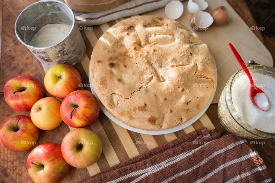 Making homemade puffed apple pie with eggs, sugar and flour.