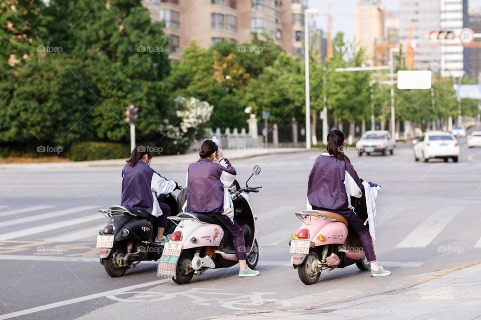 Girl on scooters 