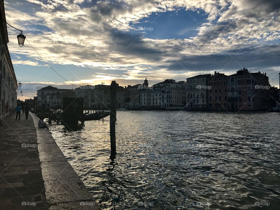 Stunning clouds over the Grand Canal at sunset in Venice, Italy