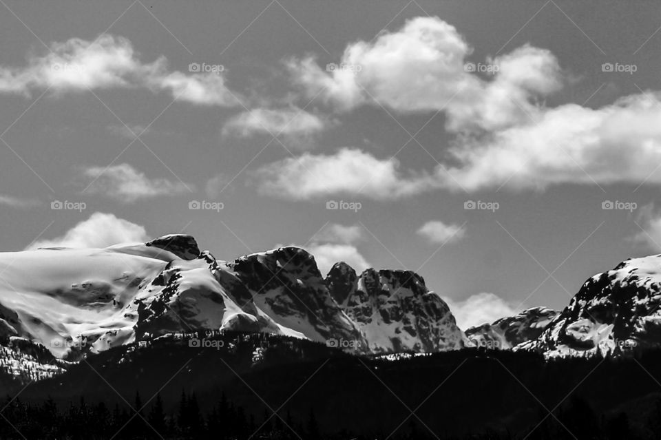 Nature at its finest! This photo was taken on a bright sunny afternoon & the colours are almost unreal they are so bright. I thought the beauty & detail of the snow covered mountains would stand out more in b&w & become the focus of the shot. 🏔