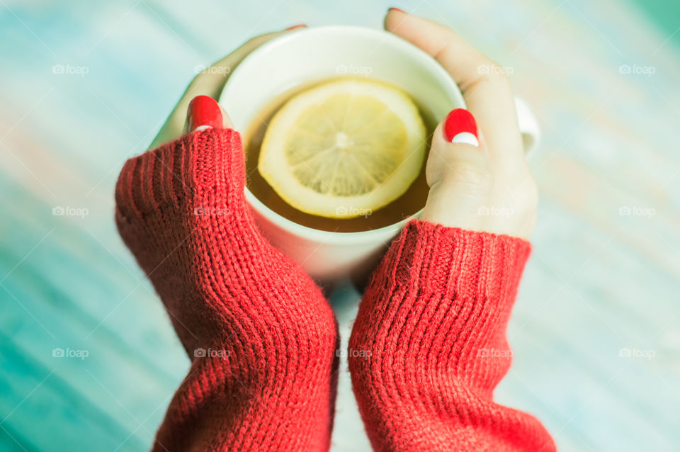 woman hand with cup of tea